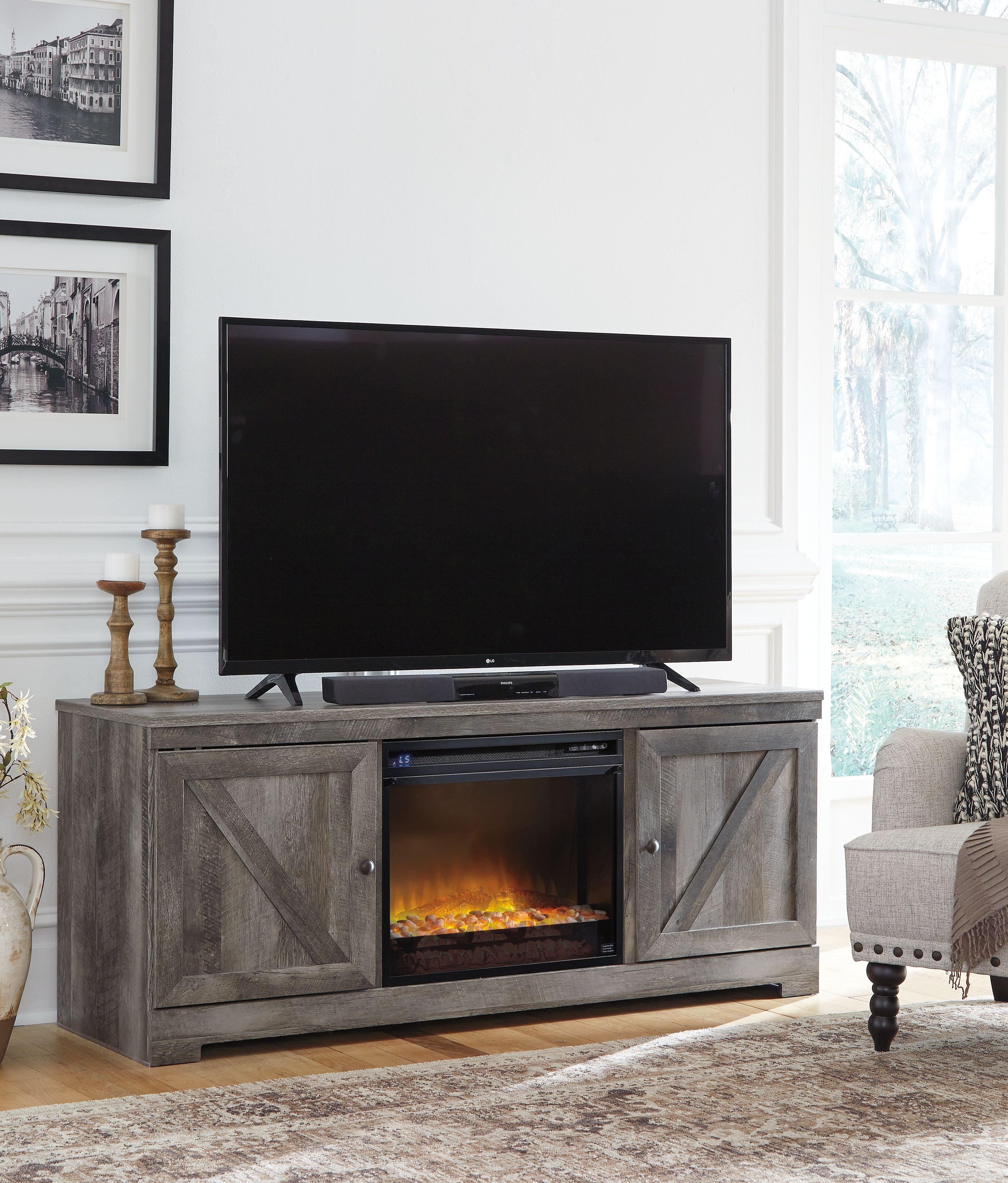 Signature Design by Ashley® - Wynnlow - Gray - 63" TV Stand With Glass/Stone Fireplace Insert - 5th Avenue Furniture
