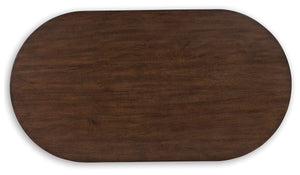 Signature Design by Ashley® - Korestone - Dark Brown - Oval Cocktail Table - 5th Avenue Furniture