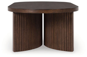 Signature Design by Ashley® - Korestone - Dark Brown - Oval Cocktail Table - 5th Avenue Furniture