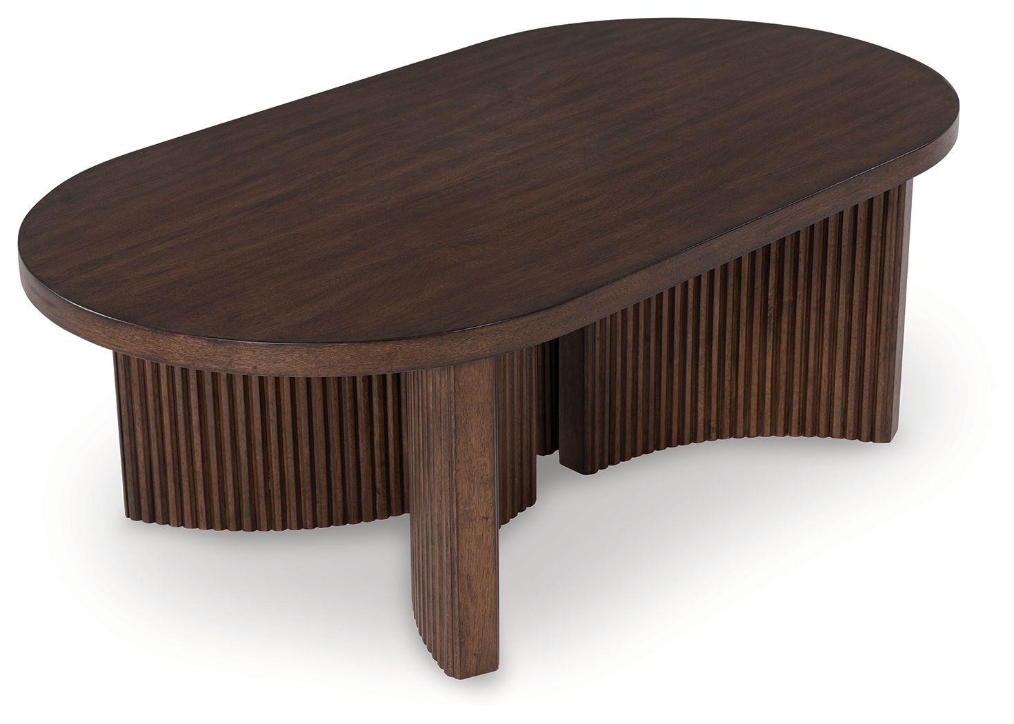 Signature Design by Ashley® - Korestone - Dark Brown - Oval Cocktail Table - 5th Avenue Furniture