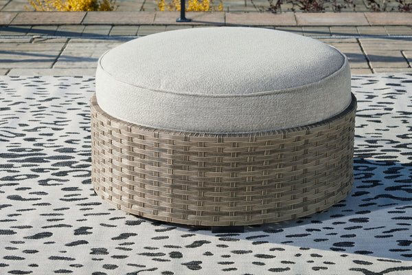 Ashley Furniture - Calworth - Beige - Ottoman With Cushion - 5th Avenue Furniture