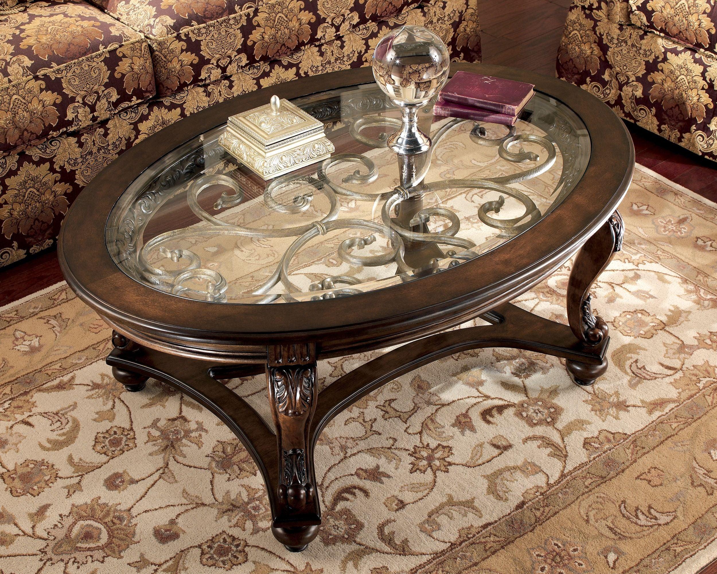 Ashley Furniture - Norcastle - Dark Brown - Oval Cocktail Table - 5th Avenue Furniture