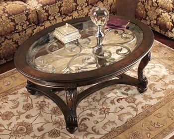 Ashley Furniture - Norcastle - Dark Brown - Oval Cocktail Table - 5th Avenue Furniture