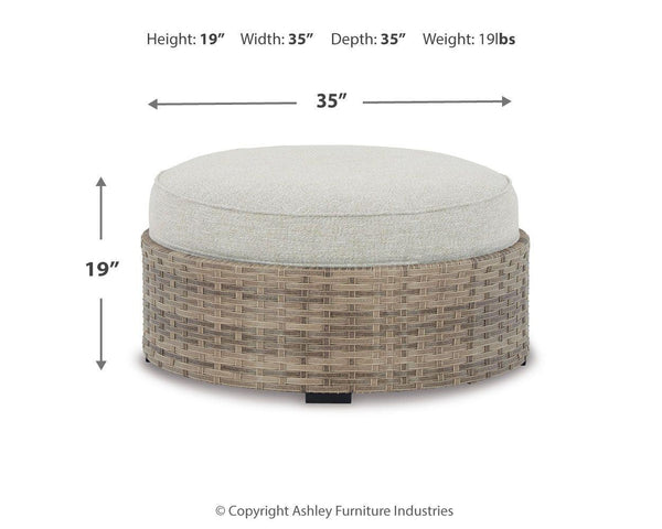 Ashley Furniture - Calworth - Beige - Ottoman With Cushion - 5th Avenue Furniture