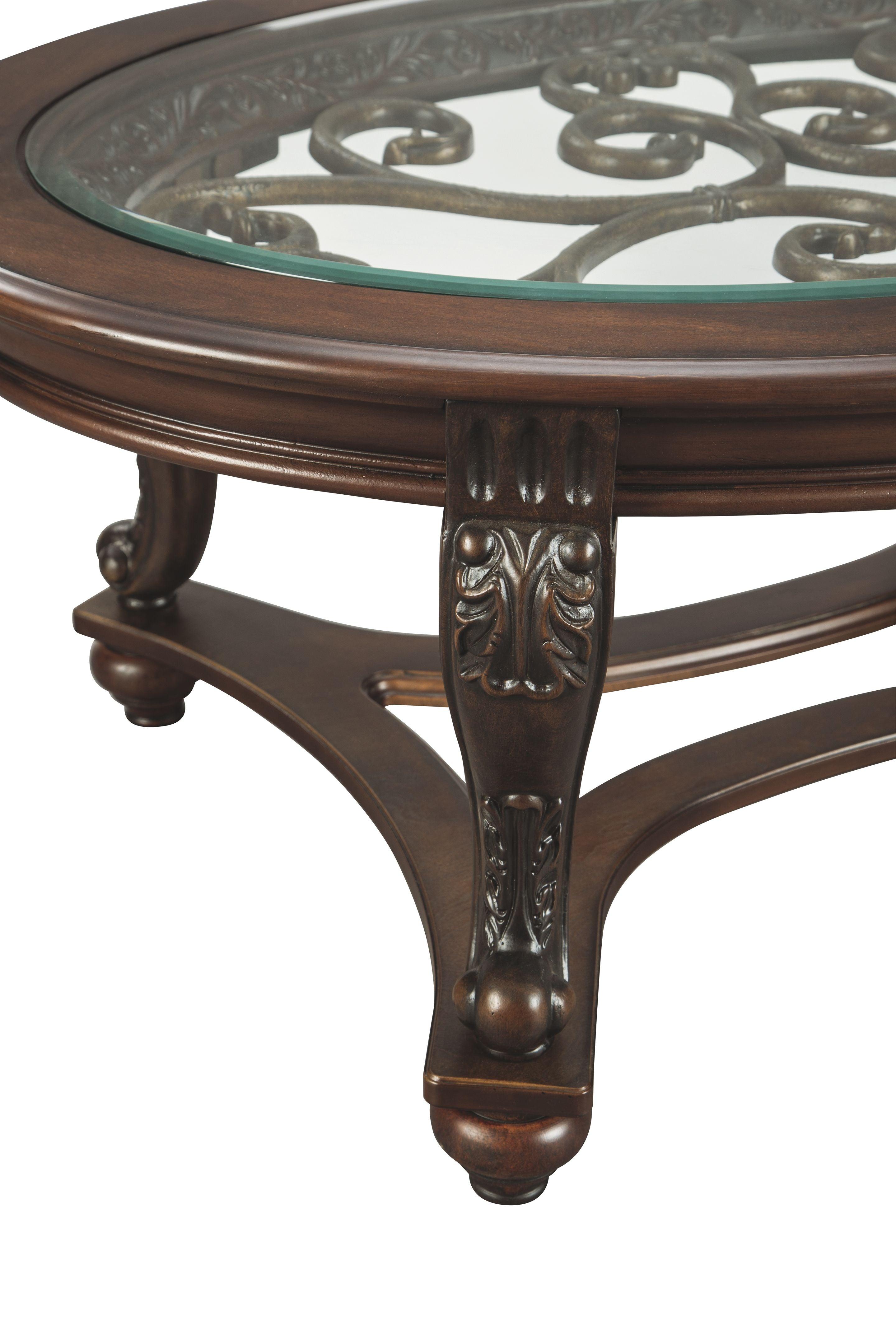 Ashley Furniture - Norcastle - Dark Brown - Oval Cocktail Table - 5th Avenue Furniture